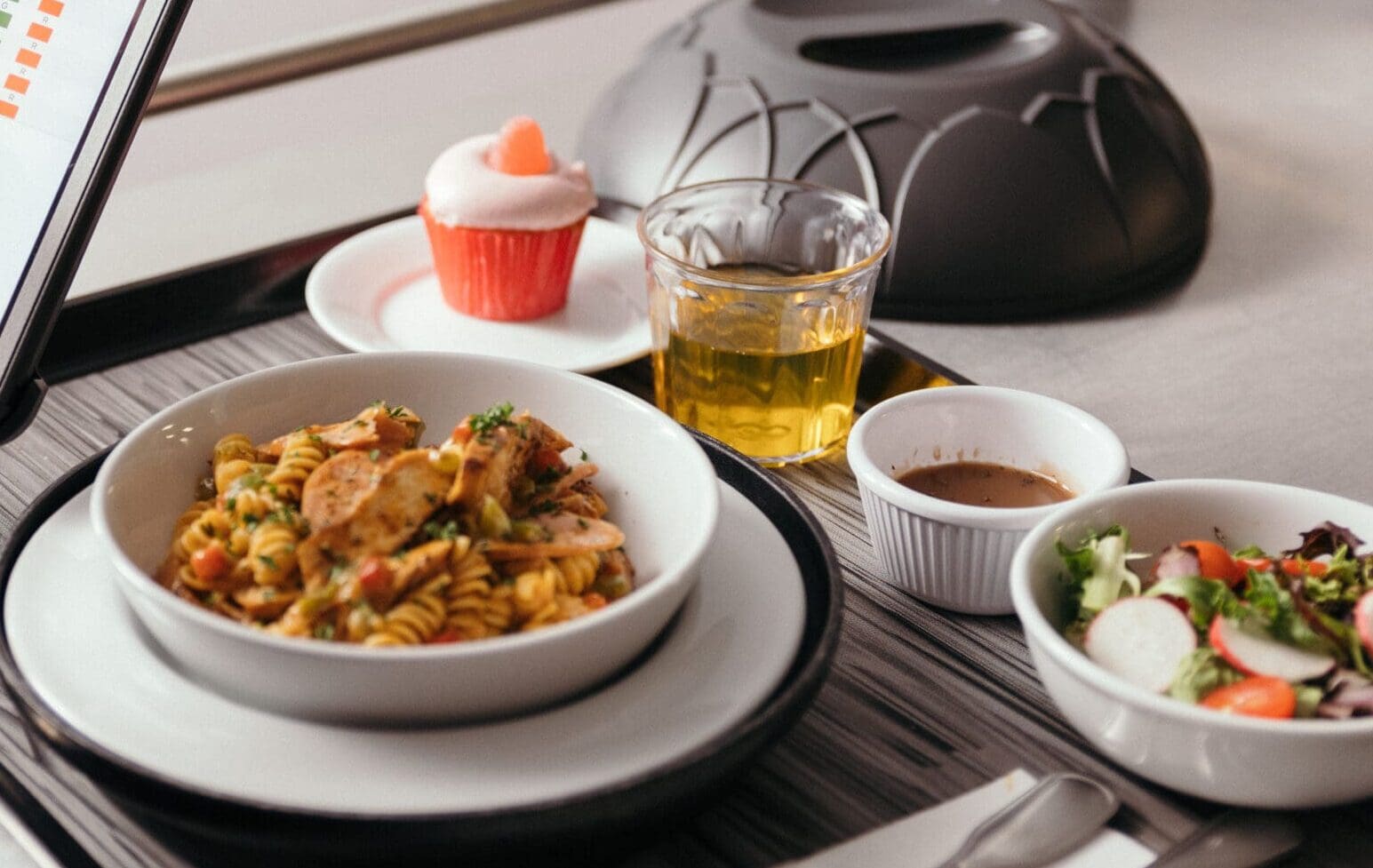 Tray of food with pasta and a salad